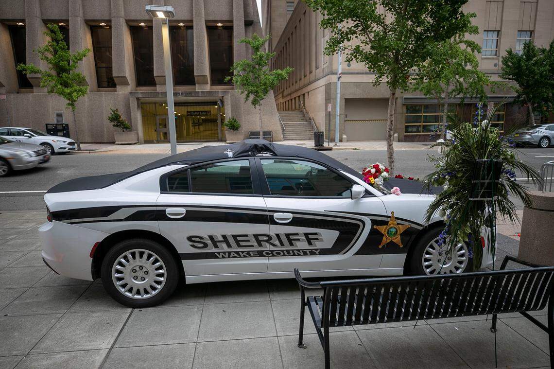 A memorial to slain Wake County Sheriffs Deputy Ned Byrd outside the Wake County Sheriffs office on Salisbury Street on Monday, August 15, 2022 in Raleigh, N.C. Deputy Byrd was found shot next to his patrol car on Thursday night August 11, 2022.