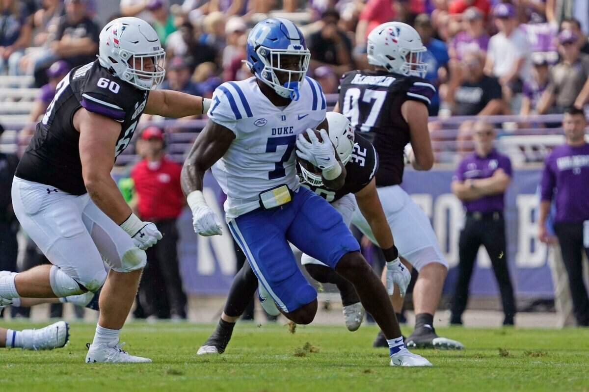 Duke running back Jordan Waters (7) runs for a touchdown against Northwestern during the first half of an NCAA college football game, Saturday, Sept.10, 2022, in Evanston, Ill.