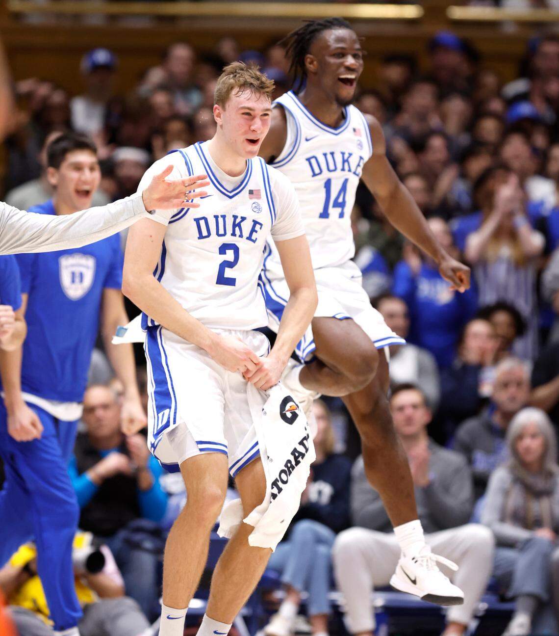 Duke’s Cooper Flagg (2) and Sion James (14) celebrate after Kon Knueppel scored during the first half of Duke’s game against Miami at Cameron Indoor Stadium in Durham, N.C., Tuesday, Jan. 14, 2025.