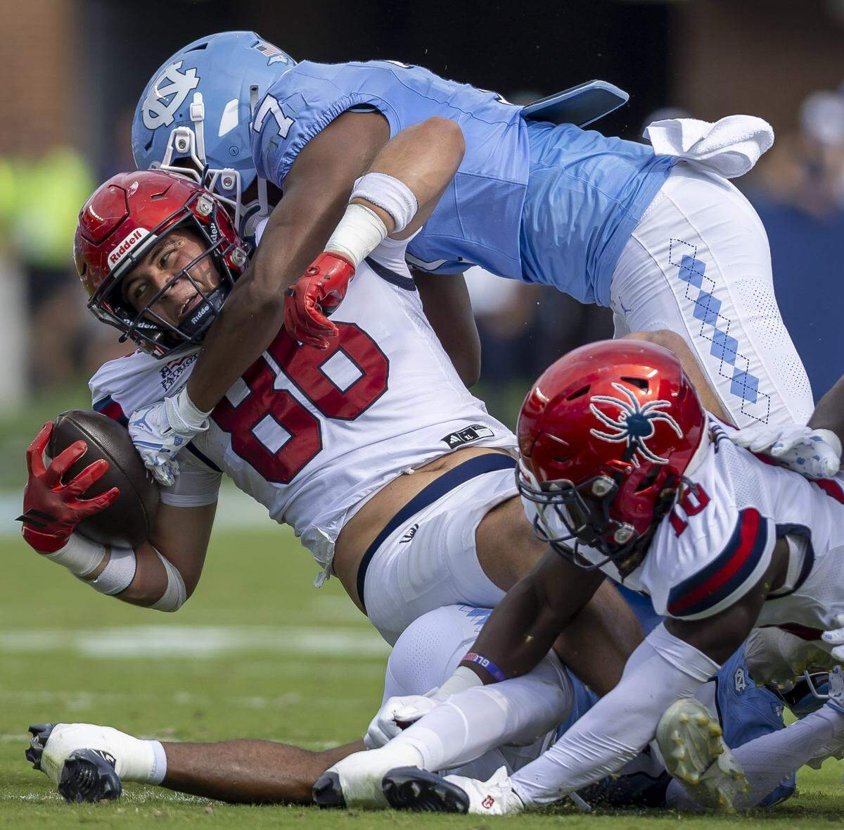 North Carolina linebacker Khmori House (7) stops Richmond tight end Aidan Steinfeldt (86) after a three-yard gain during the first quarter on Saturday, September 13, 2025 at Kenan Stadium in Chapel Hill, N.C.