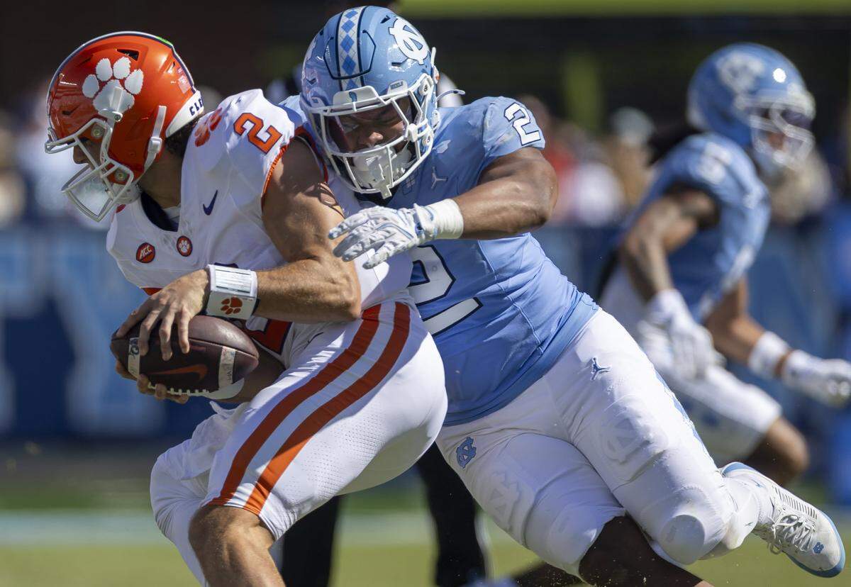 Clemson quarterback Cade Klubnik (2) is sacked by North Carolina linebacker Andrew Simpson (2) in the third quarter on Saturday, October 4, 2025 at Kenan Stadium in Chapel Hill, N.C. 