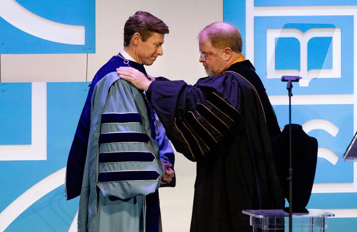 UNC system president Peter Hans (right) installs new UNC Chapel Hill chancellor Lee Roberts during a ceremony on campus, Friday, October 11, 2024.