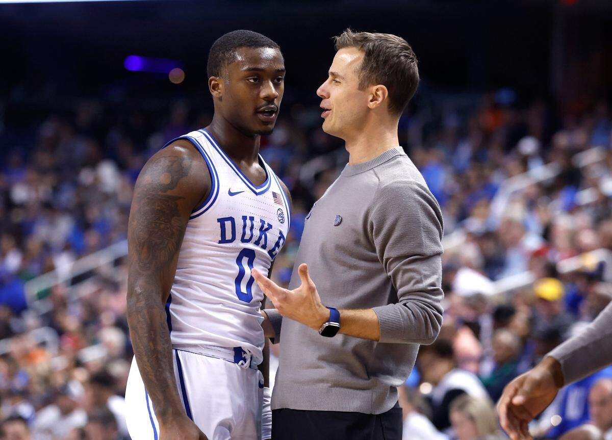 Duke head coach Jon Scheyer talks with Dariq Whitehead (0) during the first half of Duke’s game against Pitt in the quarterfinals of the ACC Men’s Basketball Tournament in Greensboro, N.C., Thursday, March 9, 2023.