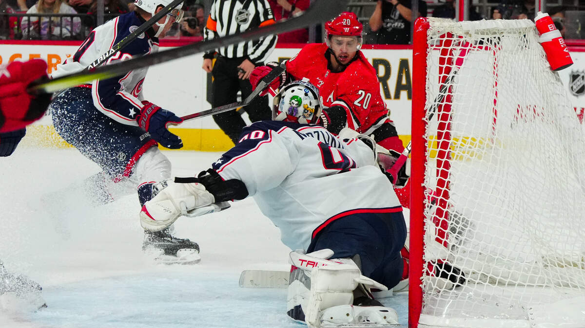 Nov 26, 2023; Raleigh, North Carolina, USA; Carolina Hurricanes center Sebastian Aho (20) is stopped by Columbus Blue Jackets goaltender Elvis Merzlikins (90) on his shot attempt during the first period at PNC Arena. Mandatory Credit: James Guillory-USA TODAY Sports