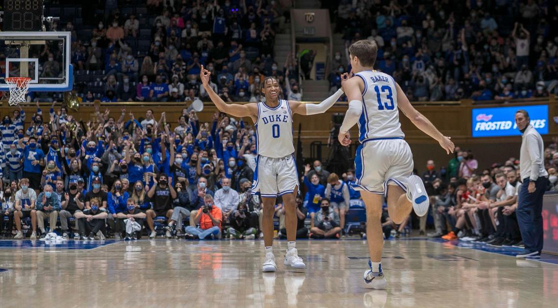 Duke’s Wendell Moore Jr. (0) reacts after a three-point basket by teammate Joey Baker (13) to give Duke a 45-38 lead in the second half against Campbell on Saturday, November 13, 2021 at Cameron Indoor Stadium in Durham, N.C.
