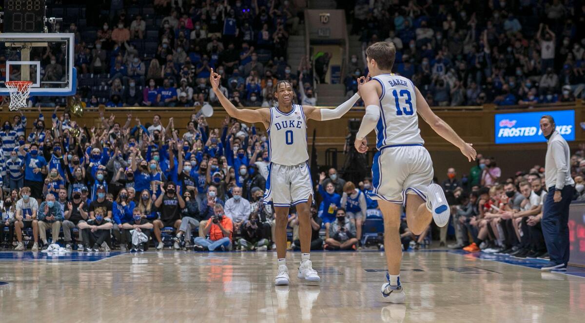 Duke’s Wendell Moore Jr. (0) reacts after a three-point basket by teammate Joey Baker (13) to give Duke a 45-38 lead in the second half against Campbell on Saturday, November 13, 2021 at Cameron Indoor Stadium in Durham, N.C.