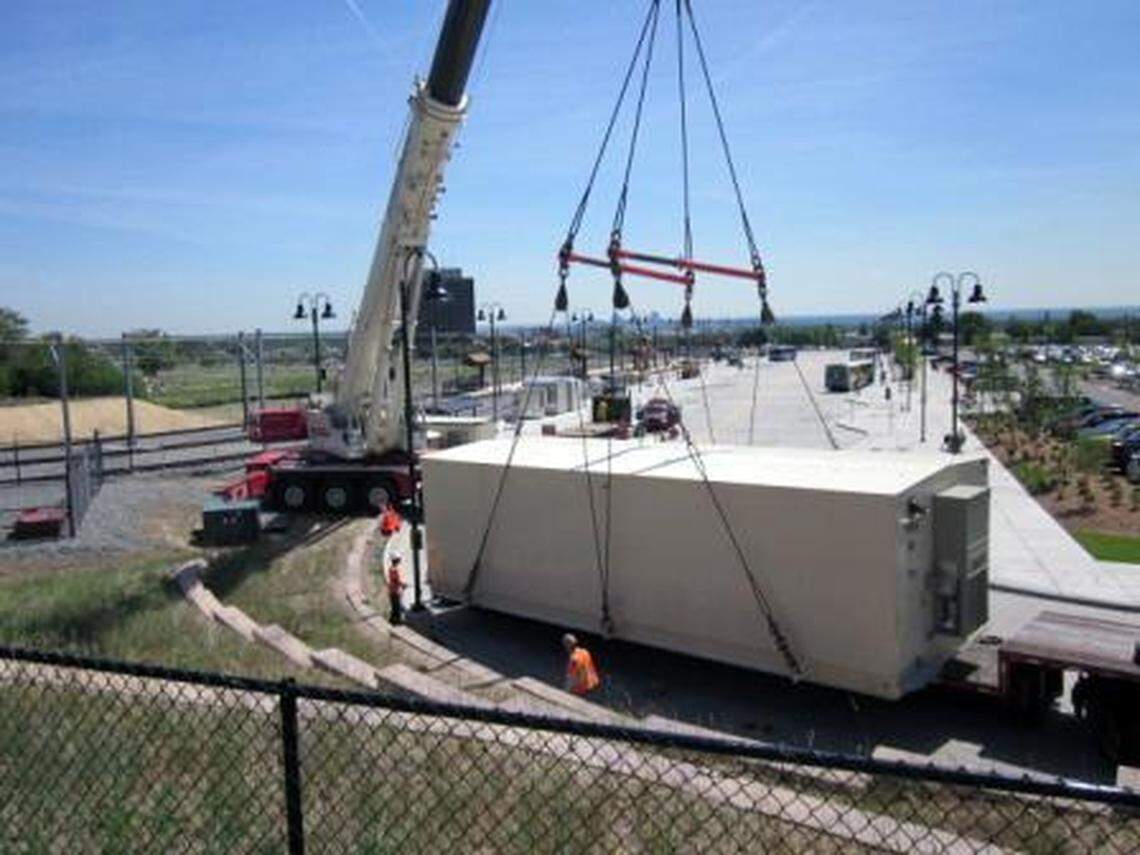 A crane lowers a 40-ton traction power substation into place for the Denver FasTracks light-rail system. The substation, similar to the substations that would be place along the Durham-Orange light rail line, is about the size of a small mobile home.