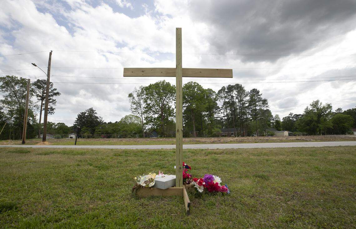 A large cross has been erected on Smoketree Way in front of the Louisburg Healthcare & Rehabilitation Center on Wednesday, April 29, 2020 in Louisburg, N.C. The cross is a memorial for the 18 patients from that facility that have died of the coronavirus.