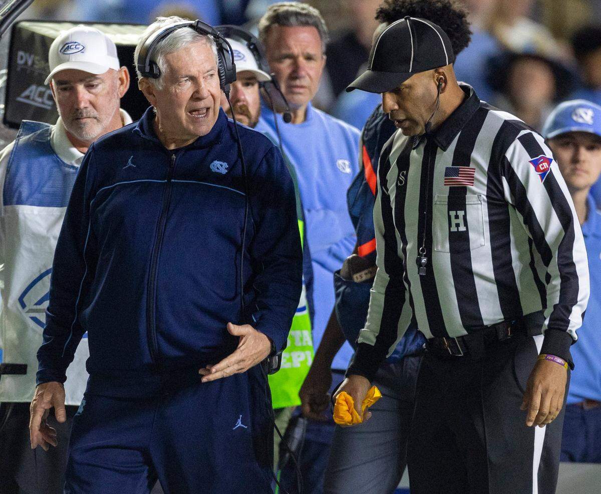 North Carolina coach Mack Brown argues a call with official Brian Perry in the second quarter against Virginia on Saturday, October 21, 2023 at Kenan Stadium in Chapel Hill, N.C.