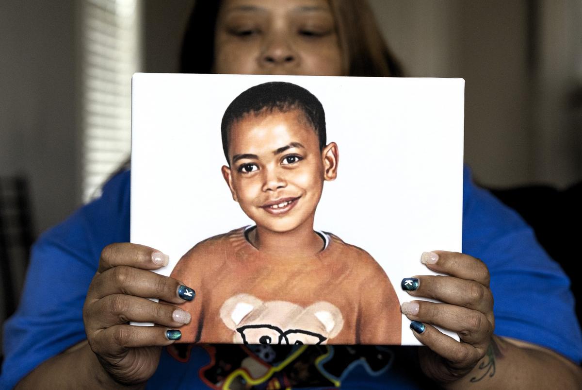 Tiffani Holloway holds a photo of her grandson, Karter, while at her home in Raleigh on Friday, Jan 26, 2024. Karter, 5, died on Jan. 1 after being admitted to the hospital after being assaulted and abused. Karter’s father, Amir Hines, has been arrested and charged with murder.