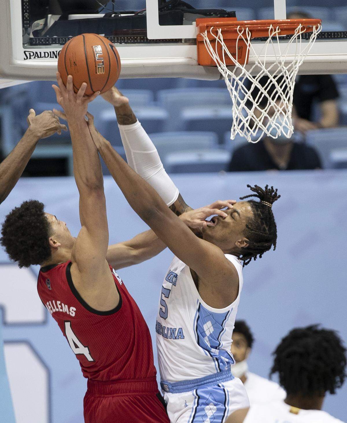 North Carolina’s Armando Bacot (5) blocks a shot by NC State’s Jericole Hellems (4) during the first half on Saturday, January 23, 2021 at the Smith Center in Chapel Hill, NC.