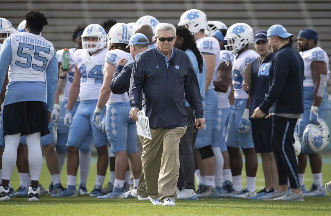 North Carolina coach Mack Brown walks away from a team huddle during the Tar Heels’ Spring football game on Saturday, April 13, 2019 at Kenan Stadium in Chapel Hill, N.C.