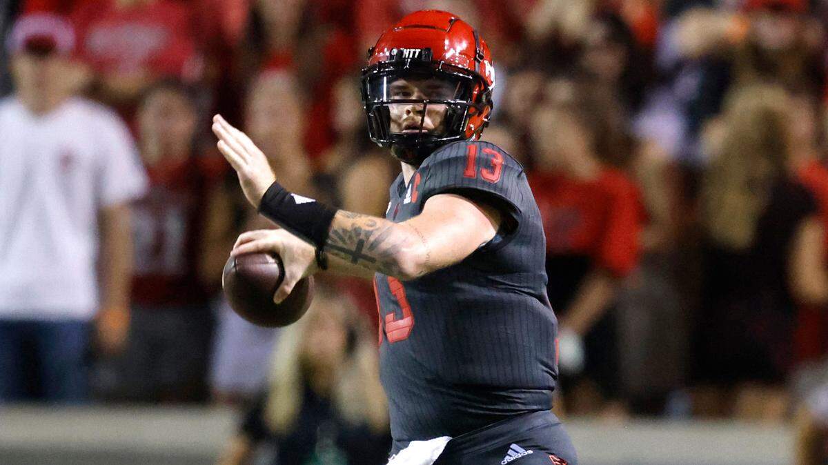 N.C. State quarterback Devin Leary (13) looks to pass during the Wolfpack’s game against USF at Carter-Finley Stadium in 2021.