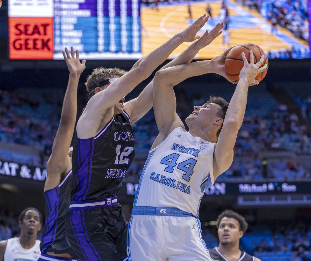 Central Arkansas guard Ty Robinson (12) defends North Carolina guard Luka Bogavac (44) in the first half on Monday, November 3, 2025 at the Smith Center in Chapel Hill, N.C.
