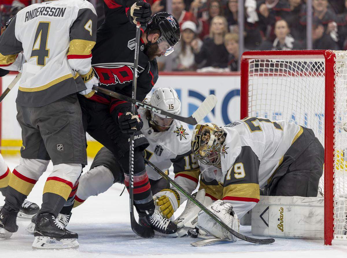 Carolina Hurricanes left wing Jordan Martinook (48) works to score against Vegas goalie Carter Hart (79) in the first period in Game 2 of the Stanley Cup Final, on Thursday, June 4, 2026 at Lenovo Center in Raleigh, N.C.