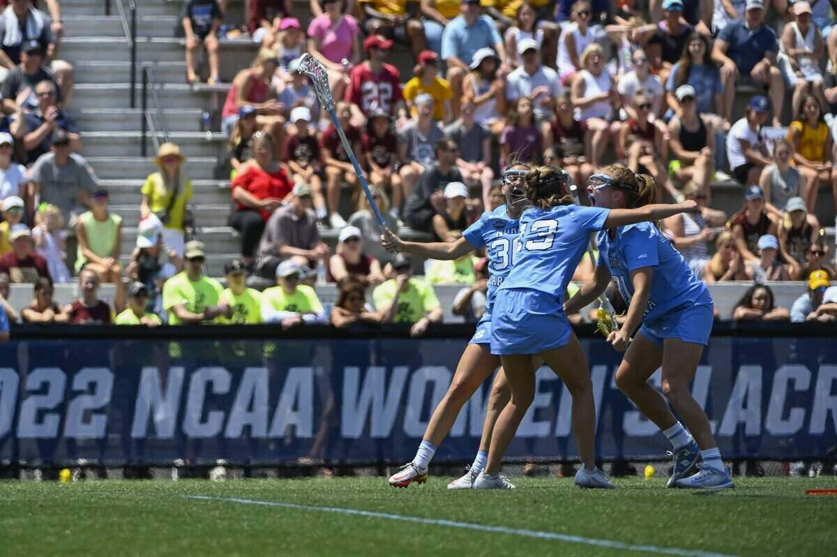 North Carolina attacks Sam Geiersbach (36), Caitlyn Wurzburger (13), and Andie Aldave celebrate Aldave’s goal against Boston College during the NCAA college Division 1 women’s lacrosse championship in Baltimore, Sunday, May 29, 2022. (Vincent Alban/The Baltimore Sun via AP)