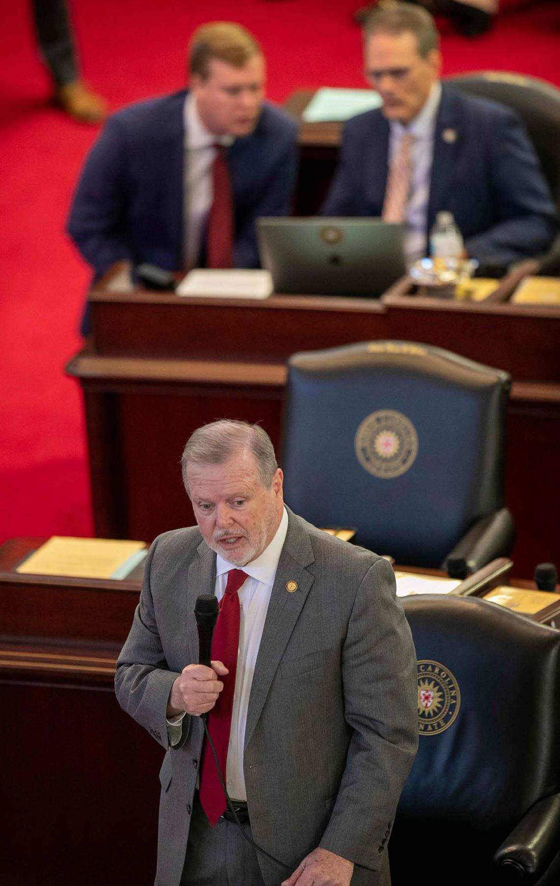 North Carolina Senate President Pro Tempore Phil Berger thanks North Carolina Governor Roy for agreeing to sign the state budget during debate of the budget bill on the Senate floor on Tuesday, November 16, 2021 in Raleigh, N.C.