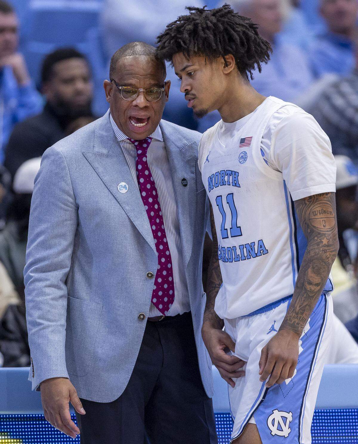 North Carolina coach Hubert Davis has a word with guard Jonathan Powell (11) after he fouled out of the game against Syracuse on Monday, February 2, 2026 at the Smith Center in Chapel Hill, N.C.