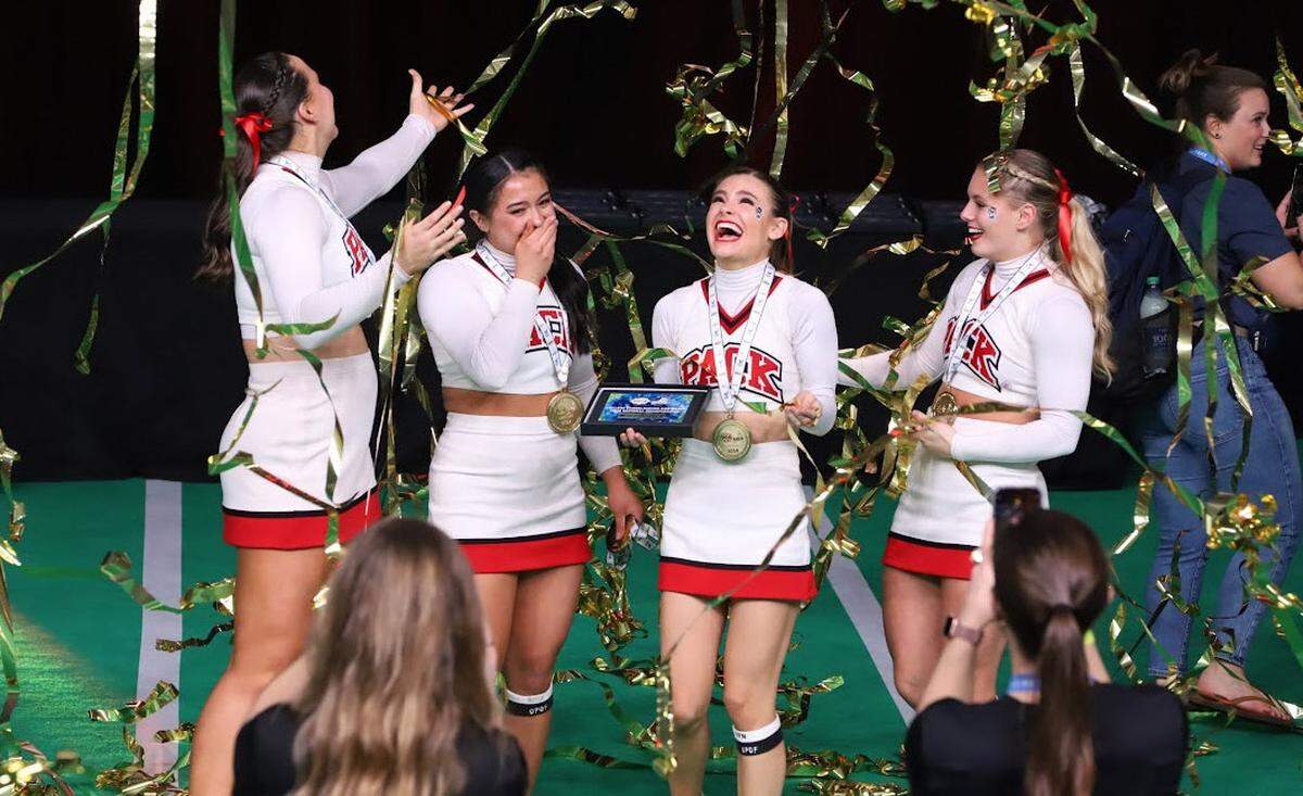 N.C. State cheerleaders Alex Devonmille, Malea Hurley, Cora Mabrey, and Angelina Potynsky, won the national championship in group stunt at the UCA College Nationals in January 2024.