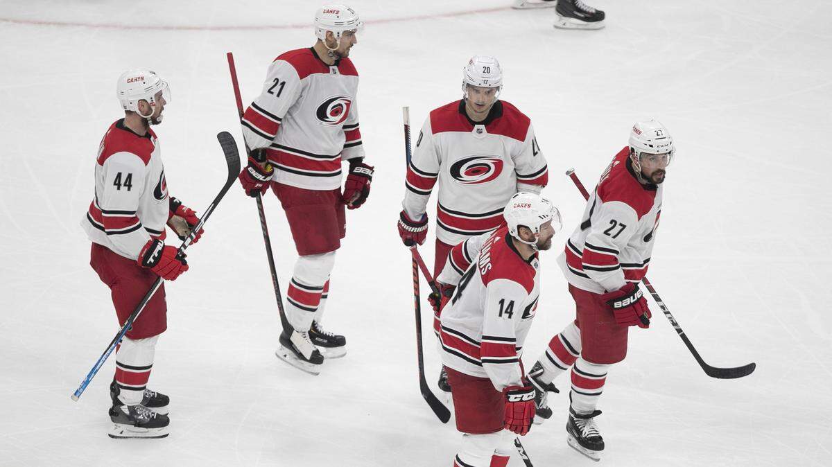 With little emotion displayed after finally scoring their first goal in the third period, Carolina Hurricanes’ Calvin de Haan (44), Nino Niederreiter (21), Sebastian Aho (20) and Justin Faulk (27) follow captain Justin Williams (14) back to the bench after Williams’ goal in Game 2 of the Eastern Conference finals on Sunday, May 12, 2019 at TD Garden in Boston, Mass. The Bruins rolled to a 6-2 victory.