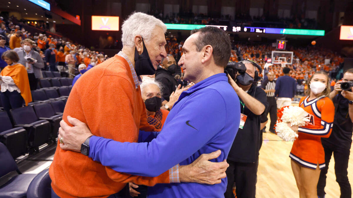 Duke head coach Mike Krzyzewski greets former Virginia head coach Terry Holland before Duke’s game against Virginia at John Paul Jones Arena in Charlottesville, VA, Wednesday, Feb. 23, 2022.