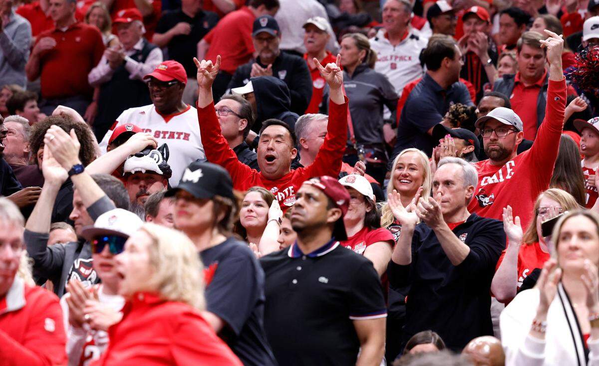 Fans cheer on the Wolfpack during the first half of N.C. State’s game against Marquette in their NCAA Tournament Sweet 16 game at the American Airlines Center in Dallas, Texas, Friday, March 29, 2024.