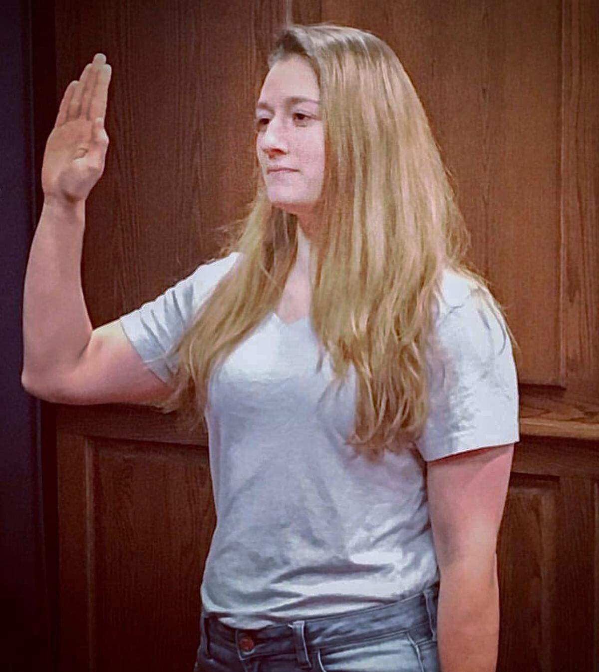 Rebecca Lobach takes the oath of enlistment into the North Carolina Army National Guard in Raleigh, N.C. in 2018 in Raleigh.
