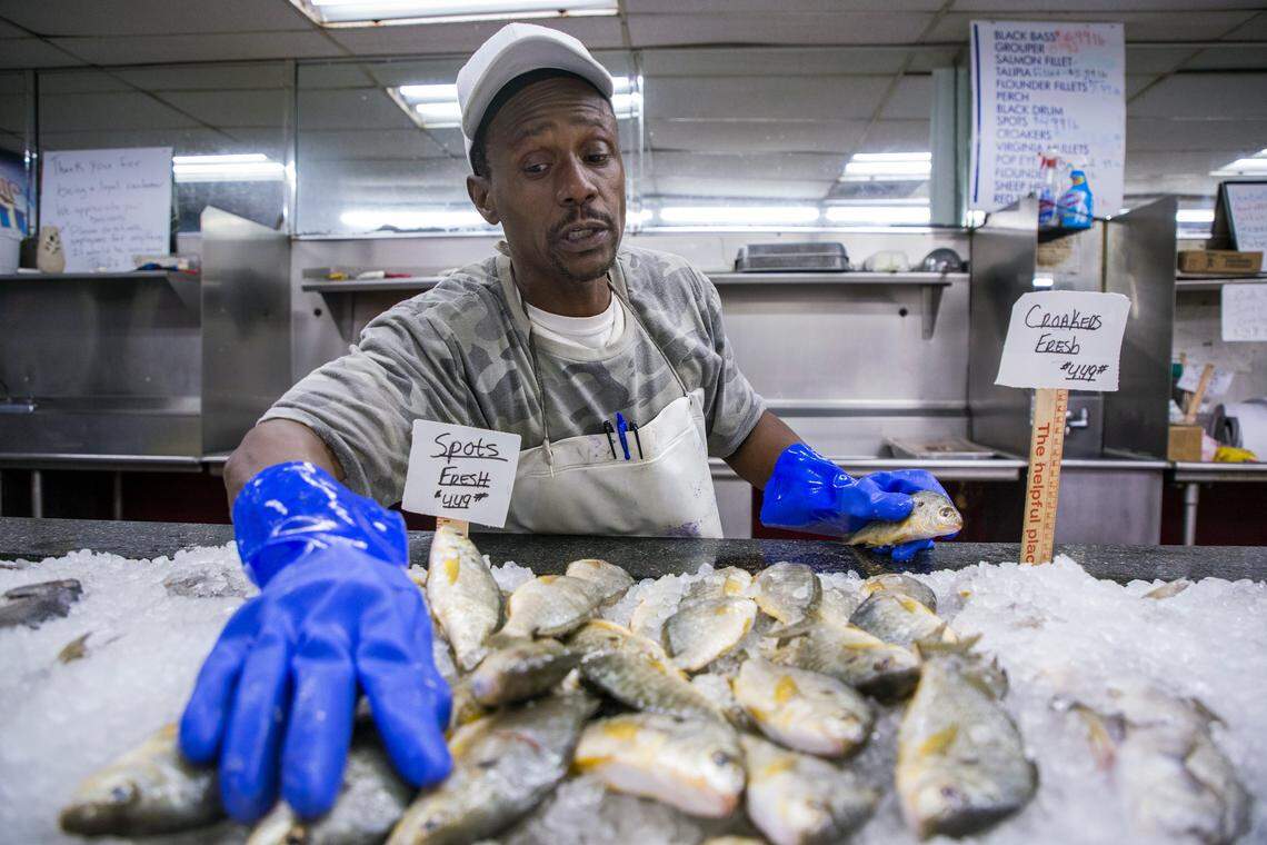 Vennis “V*Bop” Smith wraps up his shift as a fish cutter at Howards Seafood and Convenience Store, where he has worked since 1985, on Thursday, Aug. 15, 2019, in Wilmington, NC. The store is located on Castle Street at the intersection with 5th Street on the border that divides his neighborhood between NC Senate District 8, represented by Republican Sen. Bill Rabon, and District 9, represented by Democratic Sen. Harper Peterson.