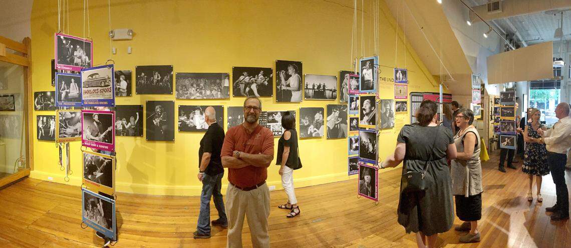 Chris Seward is surrounded by photographs from his exhibition on the Cameron Village Underground at the City of Raleigh Museum on Thursday, July 26, 2018 in Raleigh. It will be open through December.