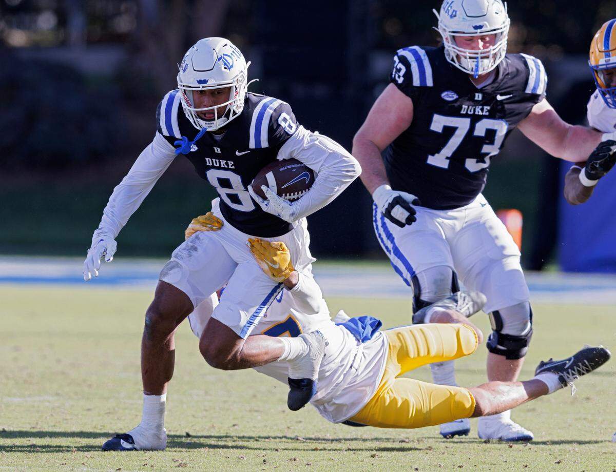 Duke’s Jordan Moore is tackled by Pittsburgh’s Javon McIntyre during the second half of the Blue Devils’ 30-19 win on Saturday, Nov. 25, 2023, at Wallace Wade Stadium in Durham, N.C.