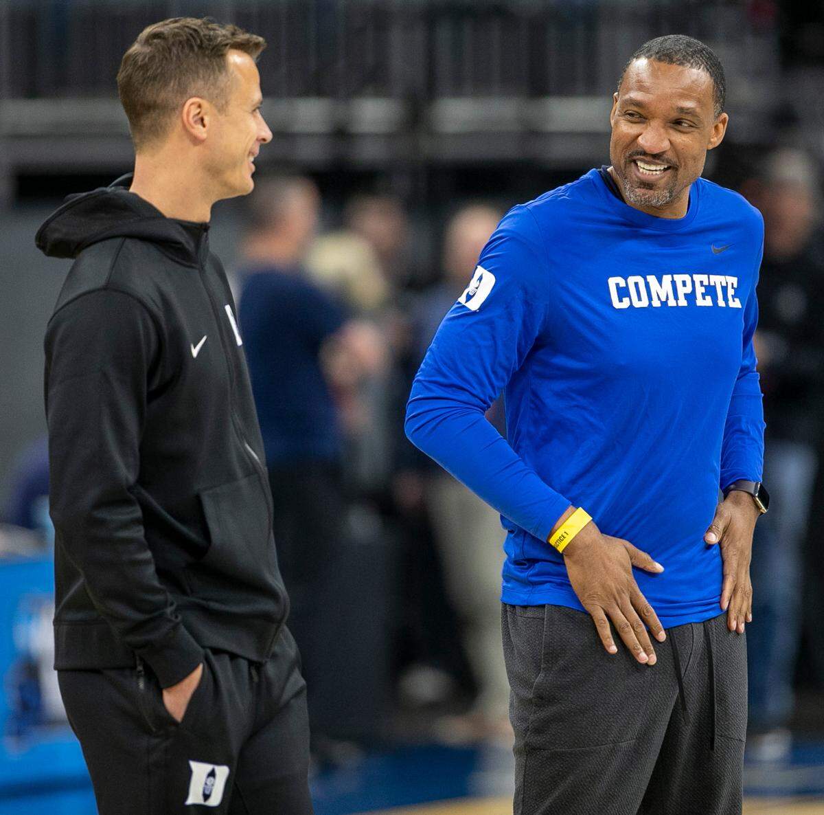 Duke assistant head coach Chris Carrawell talks with head coach Jon Scheyer during the Blue Devils’ practice on Wednesday, March 15, 2023 at the Amway Center in Orlando, Fla.