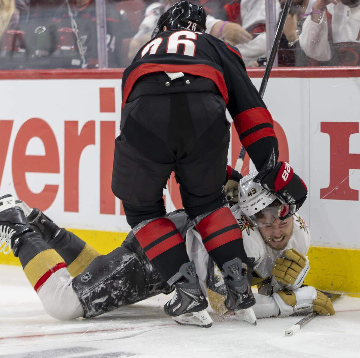 Carolina Hurricanes defenseman Sean Walker (26) checks Las Vegas left wing Ivan Barbashev (49) to the ice in the second period in Game 1 of the Stanley Cup Finals, on Tuesday, June 2, 2026 at Lenovo Center in Raleigh, N.C.