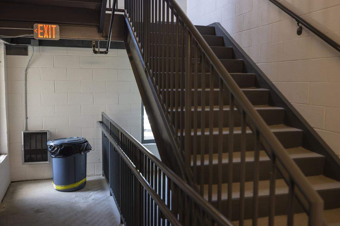 Trash cans have been placed in the stairwells on each floor of the Ashton Place Apartments for residents to place their household waste on Thursday, April 16, 2026 in Durham, N.C. The trash chutes installed in the building have been closed by management of the property, forcing residents, some with disabilities to take their garbage to the stairwells or outside.  