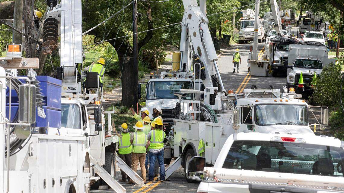 Crews work to detangle power lines near the intersection of West Markham Avenue and Washington Street on Wednesday, Aug. 16, 2023, following Tuesday evening’s strong storms in Durham, N.C.