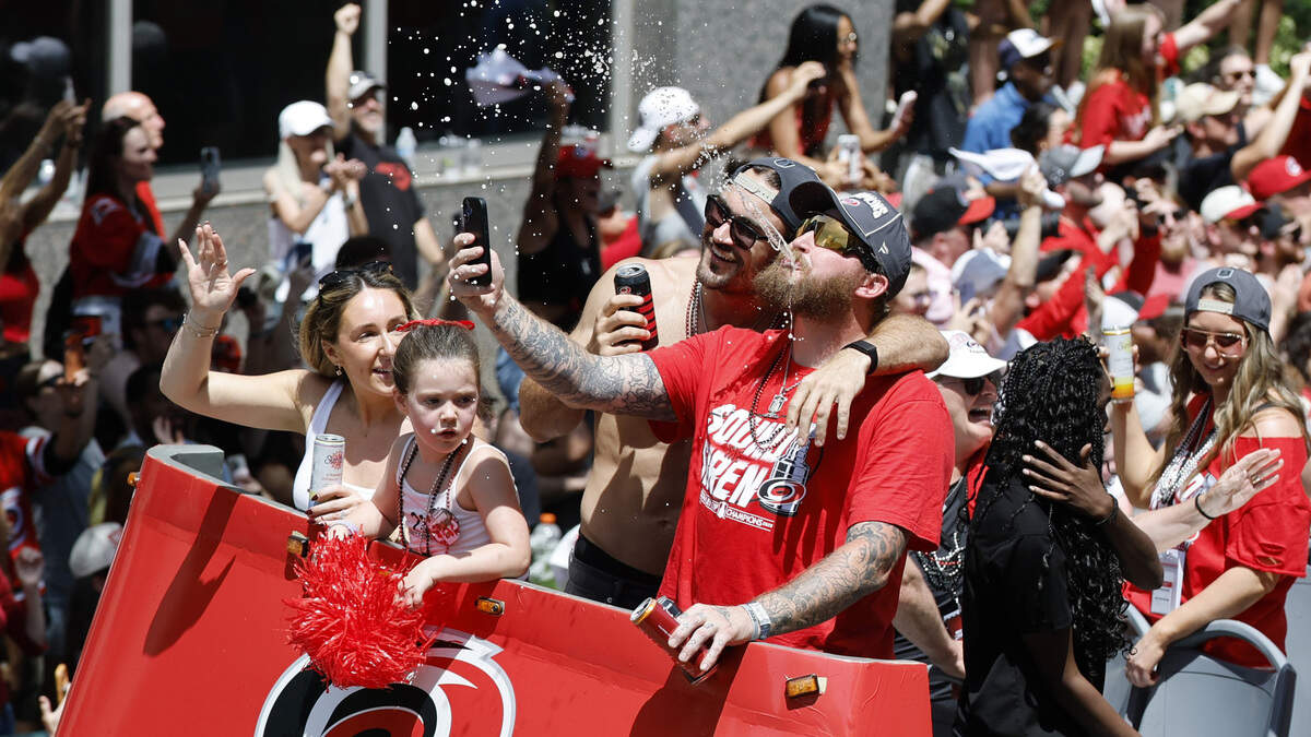 Canes players celebrate during a parade and rally for the Carolina Hurricanes in downtown Raleigh Saturday, June 20, 2026.