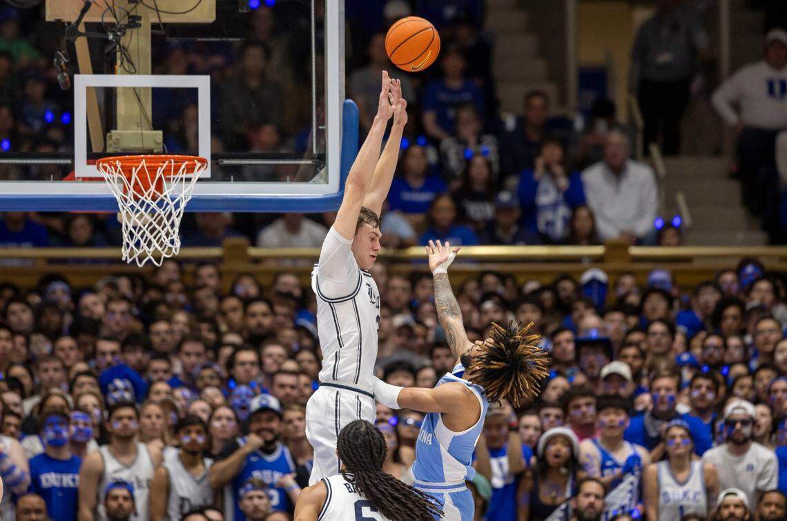 North Carolina guard R.J. Davis (4) scores his first basket of the game late in the first half against Duke’s Coper Flagg (2) on Saturday, February 1, 2025 at Cameron Indoor Stadium in Durham, N.C.