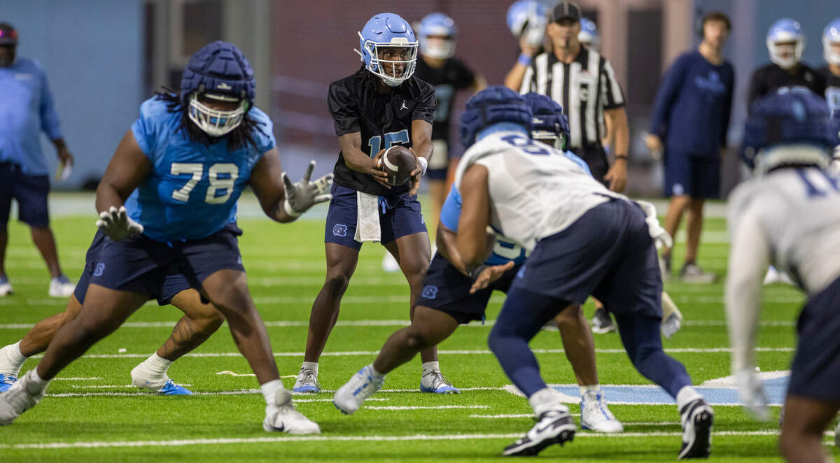 North Carolina quarterback Conner Harrell (15) runs the offense during the Tar Heels’ first practice of the season on Monday, July 29, 2024 in Chapel Hill, N.C.