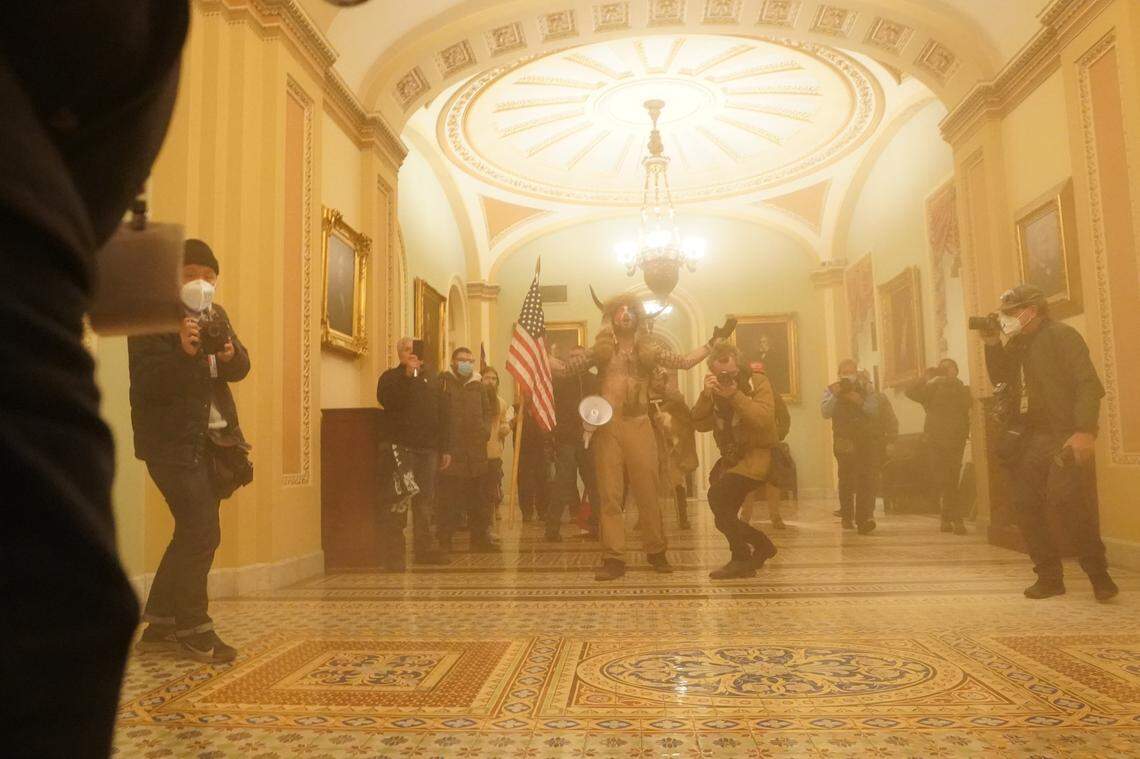 People protesting the presidential election results inside the Capitol in Washington on Wednesday, Jan. 6, 2020. The Capitol building was placed on lockdown, with senators and members of the House locked inside their chambers, as Congress began debating President-elect Joe Biden’s victory. President Trump addressed supporters near the White House before protesters marched to Capitol Hill. (Erin Schaff/The New York Times)