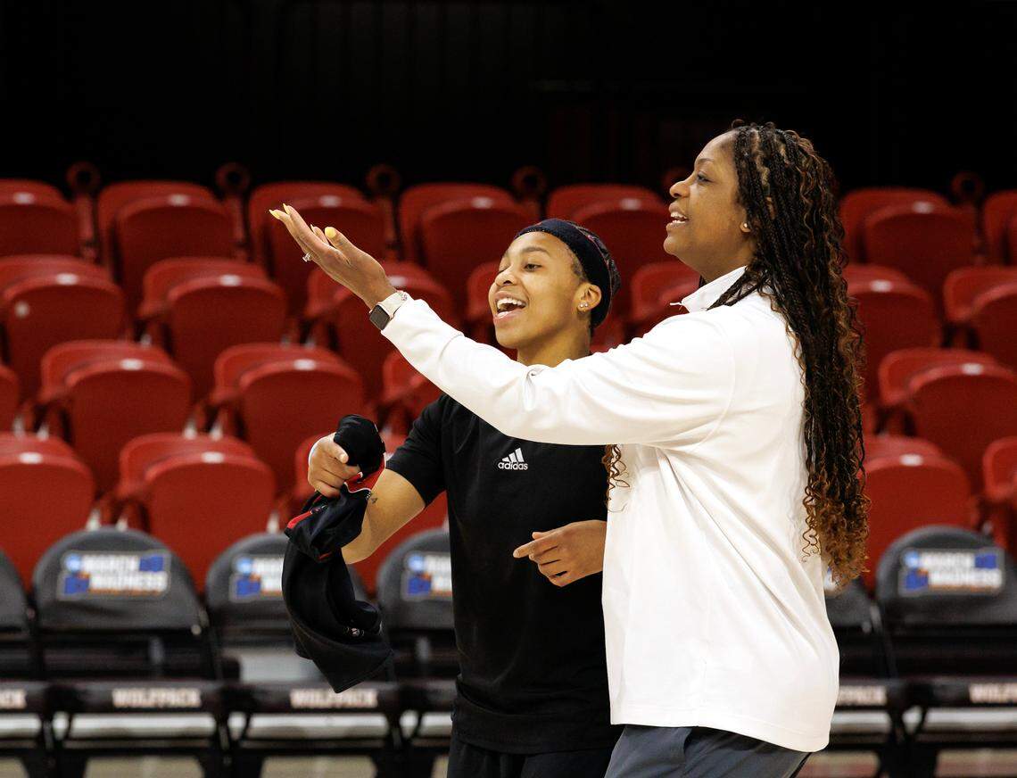 N.C. State associate head coach Nikki West shares a laugh with Zoe Brooks at the start of practice on Friday, March 21, 2025, at Reynolds Coliseum in Raleigh, N.C. N.C. State will face Vermont in the first round of the NCAA Tournament on Saturday.