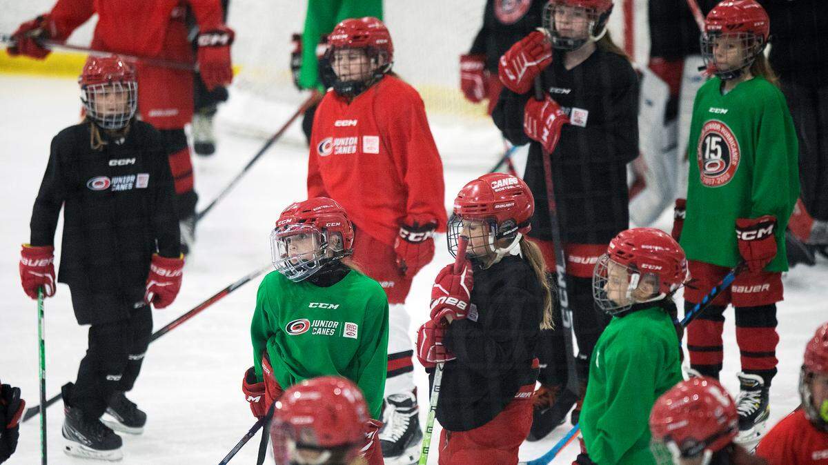 Players listen to instructions during a practice of Carolina Junior Canes girls’ teams at Invisalign Arena in Morrisville, N.C. on Tuesday, Sept. 19, 2023.