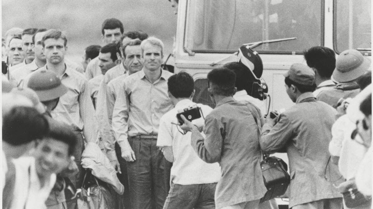 John McCain, center, as he is being released with other prisoners of war from a detention center in North Vietnam in 1973. McCain, the proud naval aviator who climbed from depths of despair as a prisoner of war in Vietnam to pinnacles of power as a Republican congressman and senator from Arizona and a two-time contender for the presidency, died on Saturday, Aug. 25, 2018,  at his home in Arizona. He was 81.