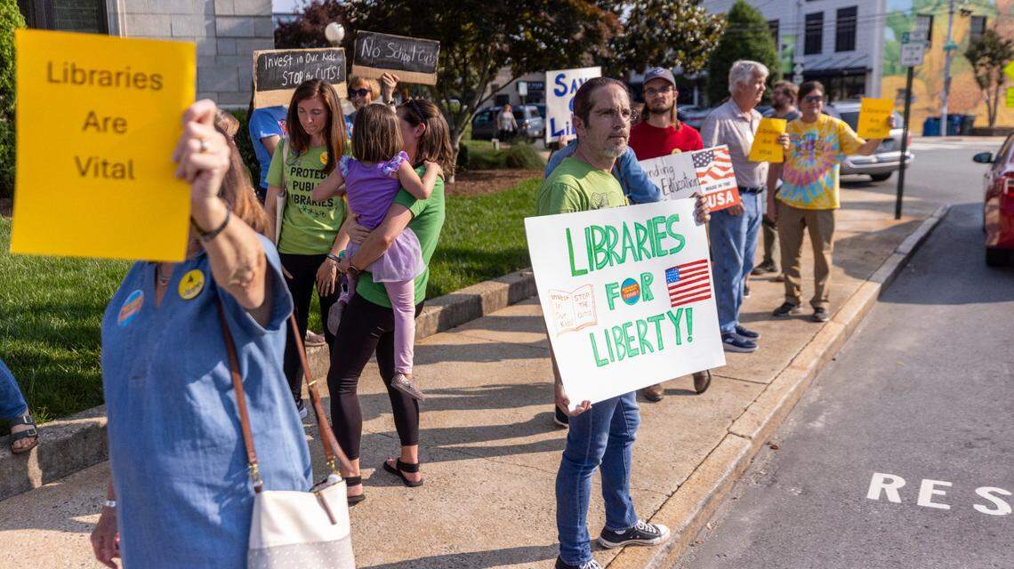 Demonstrators advocate for education funding and the protection of county libraries outside the Alamance County Courthouse on Monday, June 2, 2025, ahead of a public comment session during the monthly county commissioners meeting. The county currently funds operations for its four libraries in Graham, Burlington, Mebane and North Park. However, following recommendations from County Manager Heidi York, the Board of County Commissioners is evaluating whether funding responsibilities for three of the libraries should shift to the municipalities.