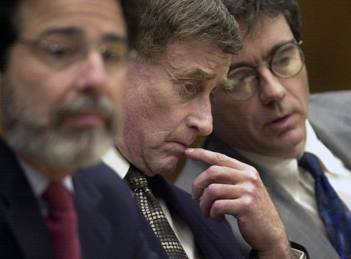 Michael Peterson, center, sits between his attorney’s David Rudolf, left, and Thomas Maher at the start of a bond hearing Monday, Jan. 14, 2001, in Durham, N.C. Bond was set at $850,000.