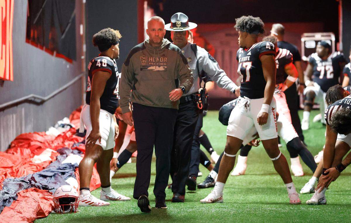 N.C. State head coach Dave Doeren walks out onto the field to thank the fans before N.C. State’s game against Virginia Tech at Carter-Finley Stadium in Raleigh, N.C., Thursday, Oct. 27, 2022.