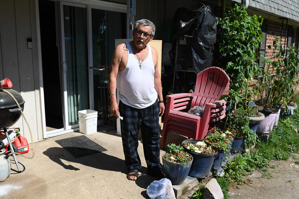 Candelario Ocampo Fuentes stands outside his three‑bedroom unit at The Point at Midtown in Raleigh’s North Hills in late May 2026.