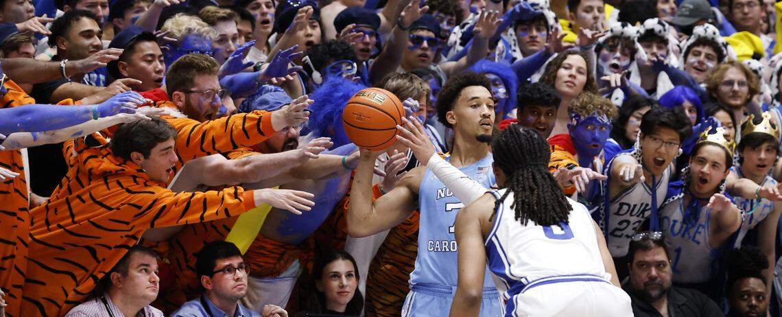 North Carolina's Seth Trimble (7) looks to inbound the ball as Duke’s Maliq Brown (6) defends him during the first half of Duke’s game against UNC at Cameron Indoor Stadium in Durham, N.C., Saturday, March 7, 2026.