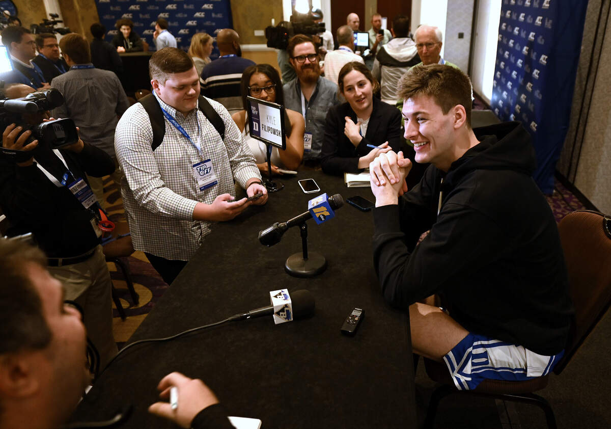 Duke center Kyle Filipowski, right, smiles as he answers a question from a reporter during the ACC Men’s TipOff event at the Hilton Charlotte Uptown Hotel on Wednesday, October 25, 2023 in Charlotte, NC.