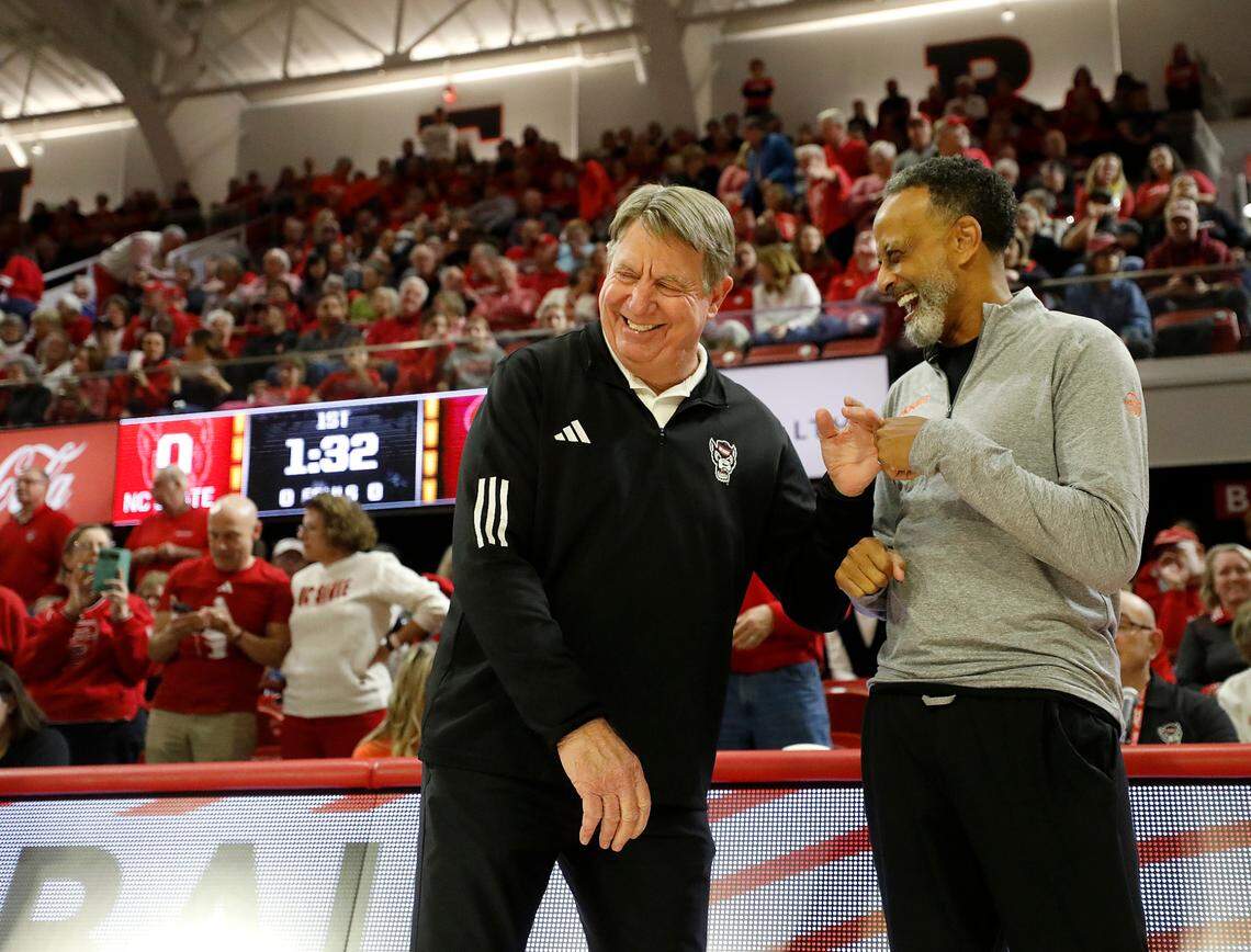 N.C. State head coach Wes Moore and Virginia Tech head coach Kenny Brooks share a laugh prior to their teams’ game on Thursday, Feb. 8, 2024, at Reynolds Coliseum in Raleigh, N.C.