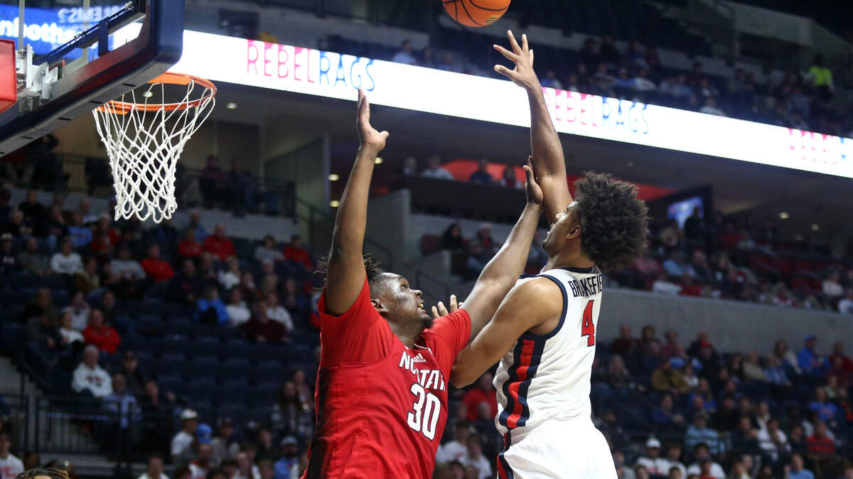 Nov 28, 2023; Oxford, Mississippi, USA; Mississippi Rebels forward Jaemyn Brakefield (4) shoots as North Carolina State Wolfpack forward DJ Burns, Jr. (30) defends during the second half at The Sandy and John Black Pavilion at Ole Miss.