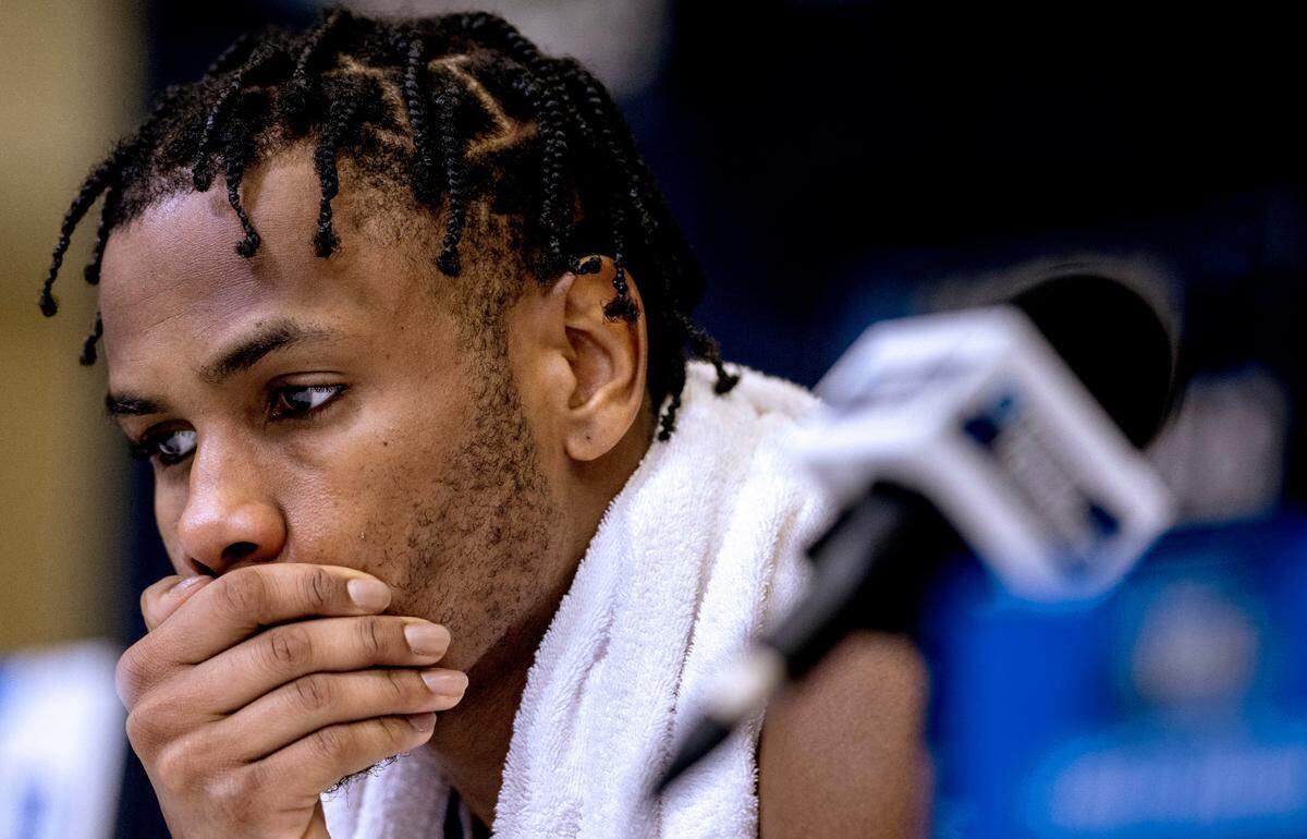 Duke’s Jeremy Roach (3) listens while coach Jon Scheyer fields questions from the media following their 65-52 loss to Tennessee in the second round of the NCAA Tournament on Saturday, March 18, 2023 at the Amway Center in Orlando, Fla.